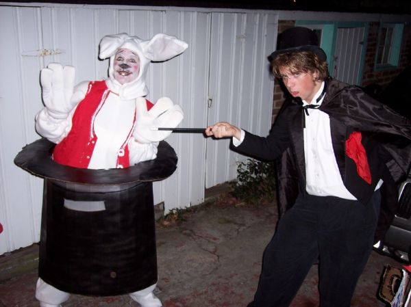 Magician pulling bunny out of hat
